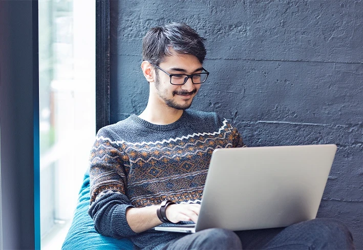 Boy working on laptop